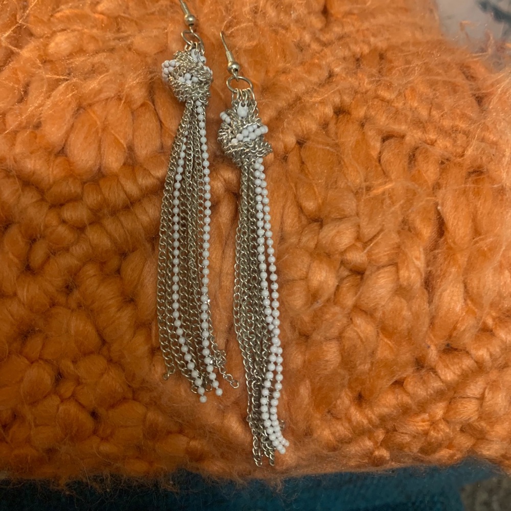 Silver and white dangle earrings